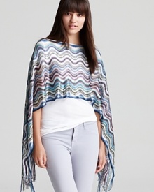 Make fashion waves effortlessly in this summery Missoni poncho. It will top off any warm-weather ensemble.