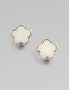 This sweet and simple, sterling silver stud is embellished with pretty mother-of-pearl stones. Mother-of-pearlSterling silverSize, about ¾Post backImported 