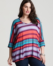 Recalling the pattern of a favorite cabana umbrella, this Splendid striped top is styled in a flowing silhouette complete with chic dolman sleeves. Recalling the pattern of a favorite cabana umbrella, this Splendid striped top is styled in a flowing silhouette complete with chic dolman sleeves.