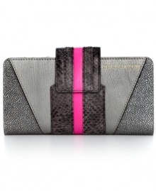 Call of the wild. Tap into the reptilian trend with this snakeskin print wallet from Juicy Couture. Soft leather is outfitted in cool colorblocking with plenty of pockets, making it the ultimate diva-licious design. Call of the wild. Tap into the reptilian trend with this snakeskin print wallet from Juicy Couture. Soft leather is outfitted in cool colorblocking with plenty of pockets, making it the ultimate diva-licious design.