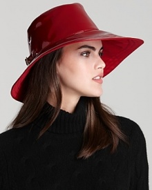 With a shiny finish and back buckle detail, Eric Javits' lightweight rain hat lends a polished look-even in stormy weather.