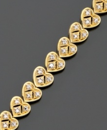 Express never ending love. This beautiful heart bracelet features diamond accents set in 18k gold over sterling silver. Approximate length: 7-1/4 inches. Express never ending love. This beautiful heart bracelet features diamond accents set in 18k gold over sterling silver. Approximate length: 7-1/4 inches.