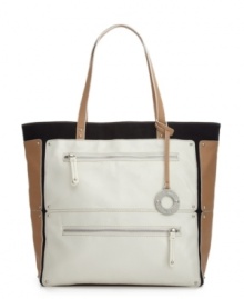 Grab hold of this trend-right design from Nine West for the perfect weekend-ready style. This oversized colorblock tote has a roomy interior to store all your daily essentials and so much more! Grab hold of this trend-right design from Nine West for the perfect weekend-ready style. This oversized colorblock tote has a roomy interior to store all your daily essentials and so much more!