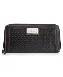 A classic Nine West silhouette gets a modern makeover with signature-embossed pattern, detail stitching and shiny plaque accent. Precisely organized interior includes credit card pockets, bill slots and zip pocket to keep valuables safe and secure. A classic Nine West silhouette gets a modern makeover with signature-embossed pattern, detail stitching and shiny plaque accent. Precisely organized interior includes credit card pockets, bill slots and zip pocket to keep valuables safe and secure.