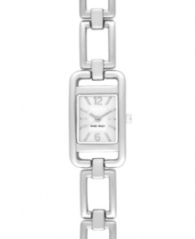 Make a striking connection with this classic design by Nine West. Crafted of silver tone mixed metal linked bracelet and rectangular case. Silver tone dial features applied numerals at twelve and six o'clock, applied stick indices, silver tone three hands and logo at six o'clock. Quartz movement. Limited lifetime warranty.