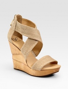 Wide burlap criss-cross straps and an exposed back zipper enhance this architectural wooden wedge. Wooden wedge, 4½ (115mm)Wooden platform, 1 (25mm)Compares to a 3½ heel (90mm)Burlap upperBack zipperLeather liningRubber solePadded insoleImportedOUR FIT MODEL RECOMMENDS ordering true size. 