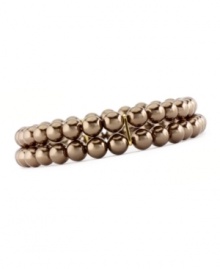 The lustrous chocolate brown color of Charter Club's two-row simulated pearl (6 mm) stretch bracelet makes it a perfect complement to your fall wardrobe. Made in gold tone mixed metal. Approximate diameter: 2-1/2 inches. The lustrous chocolate brown color of Charter Club's two-row simulated pearl (6 mm) stretch bracelet makes it a perfect complement to your fall wardrobe. Made in gold tone mixed metal. Approximate diameter: 2-1/2 inches.