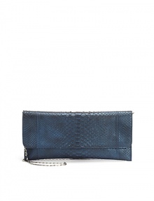 THE LOOKTuck-away shoulder chainEnvelope silhouetteMagnetic flap closureOne inside zip pocketInside logo detailTHE MEASUREMENTShoulder chain, 14 drop12W X 5½H X ¼DTHE MATERIALPythonLeather and printed fabric liningORIGINMade in USA THE LOOKTuck-away shoulder chainEnvelope silhouetteMagnetic flap closureOne inside zip pocketInside logo detailTHE MEASUREMENTShoulder chain, 14 drop12W X 5½H X ¼DTHE MATERIALPythonLeather and printed fabric liningORIGINMade in USA