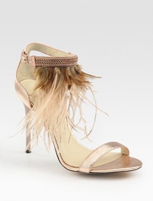Shimmering metallic leather straps embellished by an array of exotic feathers. Self-covered heel, 4 (100mm)Metallic leather and feather upperAdjustable ankle strapLeather lining and solePadded insoleMade in ItalyOUR FIT MODEL RECOMMENDS ordering true size. 