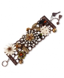 A pretty flower bed from Betsey Johnson. This wide toggle bracelet showcases a large brown tone flower with glass pearls and crystal accents, pearl-colored flowers with topaz-colored crystal accents, gold tone leaves with crystal accents and a brown bow with crystal accents. Crafted in brown tone mixed metal. Approximate length: 7-1/2 inches.