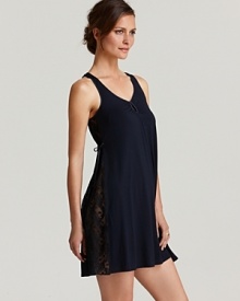 An A-line sleeveless chemise with pretty lace panels along sides and back.