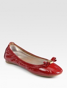 High-gloss patent leather flat has a stretchy upper and logoed bow adornment. Patent leather upperLeather liningRubber solePadded insoleImportedOUR FIT MODEL RECOMMENDS ordering true size. 