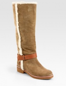 Shearling trim adds textural appeal to this suede design, finished with a wrap-around leather ankle strap. Rubber heel, 1¼ (30mm)Rubber platform, ½ (15mm)Compares to a ¾ heel (20mm)Shaft, 15Leg circumference, 16Suede upper with shearling trim and a leather adjustable tab ankle strapPull-on styleLeather liningRubber solePadded insoleImported