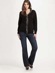 A knit above the rest, a cotton cardigan with an animal-print, chiffon collar and trim for a unique look. Animal print collar and trimLong sleevesSnap frontFront pocketsRibbed trimAbout 25 from shoulder to hemCottonHand washImported