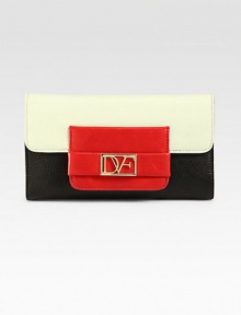 A high-contrast, colorblock design in supple leather with a logo emblem.Snap button flap closureOne inside zip pocketFifteen credit card slotsFive bill compartmentsLeather lining7½W X 4½H X ¾DImported A high-contrast, colorblock design in supple leather with a logo emblem.Snap button flap closureOne inside zip pocketFifteen credit card slotsFive bill compartmentsLeather lining7½W X 4½H X ¾DImported