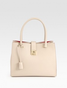 Instantly classic leather silhouette with double top handles and a flap lock closure. Double top handles, 7 dropLock closure on front flapOne outside back zip pocketOne inside zip pocketFully lined9W X 12½H X 5DMade in Italy Instantly classic leather silhouette with double top handles and a flap lock closure. Double top handles, 7 dropLock closure on front flapOne outside back zip pocketOne inside zip pocketFully lined9W X 12½H X 5DMade in Italy