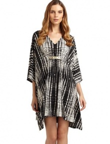 THE LOOKGraphic batik-inspired print on soft jerseyV-necklineRuched center with hammered metal ringsLong sleevesTHE FITAbout 35 from shoulder to hemTHE MATERIAL95% polyester/5% spandexCARE & ORIGINMachine washImportedModel shown is 5'11 (180cm) wearing US size Small. THE LOOKGraphic batik-inspired print on soft jerseyV-necklineRuched center with hammered metal ringsLong sleevesTHE FITAbout 35 from shoulder to hemTHE MATERIAL95% polyester/5% spandexCARE & ORIGINMachine washImportedModel shown is 5'11 (180cm) wearing US size Small.