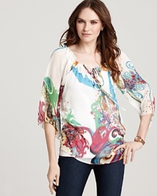 Painterly prints float across this Shiloh 770 blouse for a bold take on bohemian-chic. Team with sleek skinnies to highlight the vibrant hues. Painterly prints float across this Shiloh 770 blouse for a bold take on bohemian-chic. Team with sleek skinnies to highlight the vibrant hues.