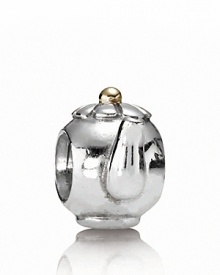 PANDORA's sterling silver teapot charm is topped off with a 14K gold lid. PANDORA's sterling silver teapot charm is topped off with a 14K gold lid.