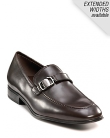 Sleek and stylish slip-on dress shoes with leather strap and buckle detail at top. Round toe. Gancini insignia etched on buckle and heel. Leather sole with slightly stacked heel. Sleek and stylish slip-on dress shoes with leather strap and buckle detail at top. Round toe. Gancini insignia etched on buckle and heel. Leather sole with slightly stacked heel.