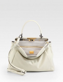 A classic ladylike silhouette in ultra supple leather with a framed top and decadent suede lining.Top handle, 4 drop Adjustable detachable shoulder strap 15-26 drop Turnlock closure Protective metal feet One inside zip pocket Two center compartments Suede lining 13W X 9½H X 4D Made in Italy A classic ladylike silhouette in ultra supple leather with a framed top and decadent suede lining.Top handle, 4 drop Adjustable detachable shoulder strap 15-26 drop Turnlock closure Protective metal feet One inside zip pocket Two center compartments Suede lining 13W X 9½H X 4D Made in Italy
