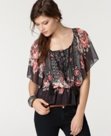 A mixed floral print and tassel tie lace-up detail adds a boho flair to this Bar III chiffon top -- adorable with skinny jeans!