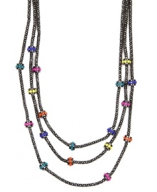 A colorful remix on a stylish classic. Nine West's three-row necklace combines multicolored plastic beads with a hematite-plated mixed metal setting. Approximate length: 18 inches. Approximate drop: 2 inches. A colorful remix on a stylish classic. Nine West's three-row necklace combines multicolored plastic beads with a hematite-plated mixed metal setting. Approximate length: 18 inches. Approximate drop: 2 inches.