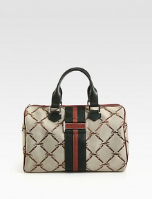 Iconic jacquard accented in supple two-tone leather.Double leather top handles, 6 dropTop zip closureOne inside zip pocketTwo inside open pocketsFully lined12½W X 8H X 7DImported Iconic jacquard accented in supple two-tone leather.Double leather top handles, 6 dropTop zip closureOne inside zip pocketTwo inside open pocketsFully lined12½W X 8H X 7DImported