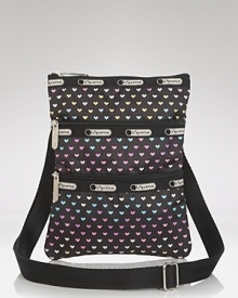 LeSportsac's latest crossbody features a cool color blocked effect and plenty of pockets, sure to add a on-trend pop when you're darting around town. LeSportsac's latest crossbody features a cool color blocked effect and plenty of pockets, sure to add a on-trend pop when you're darting around town.
