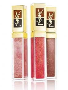 Dress your lips in sophisticated, high-shine shimmer with Yves Saint Laurent Golden Gloss, featuring sparkling 24-carat gold flecks (0.2%). With a complex of nourishing oils to protect and hydrate your lips and a fresh mango scent, these glosses are instant gratification for lips offering glamour and care together. Contains: Golden Gloss No. 2, 3, 10 Dress your lips in sophisticated, high-shine shimmer with Yves Saint Laurent Golden Gloss, featuring sparkling 24-carat gold flecks (0.2%). With a complex of nourishing oils to protect and hydrate your lips and a fresh mango scent, these glosses are instant gratification for lips offering glamour and care together. Contains: Golden Gloss No. 2, 3, 10