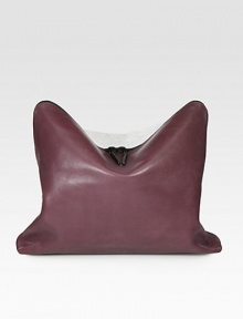 Smooth leather and pebbled leather contrasts in an elegant fashion, perfect for day to night.Convertible top handle strap, 1 dropTop zip closureOne inside zip pocketFully lined15W X 8H X 3½DImported