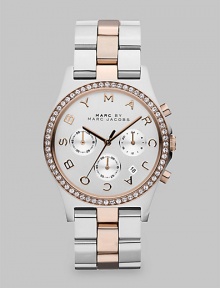 A versatile, two-tone timepiece with dazzling crystals and a signature dial. Quartz movementWater resistant to 5 ATMRound stainless steel case, 40mm (1.6)Crystal bezelSilvertone chronograph dialLogo markersDate display between 4 and 5 o'clockSecond hand Two-tone ion-plated stainless steel link braceletImported