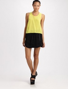 Featherweight matte silk, cropped in the front and crafted with a sporty racerback.ScoopneckSleevelessTaped seamsHem shorter in frontAbout 28 from shoulder to hemSilkDry cleanImported Featherweight matte silk, cropped in the front and crafted with a sporty racerback.ScoopneckSleevelessTaped seamsHem shorter in frontAbout 28 from shoulder to hemSilkDry cleanImported