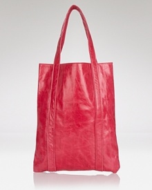 Long and lean, Dewdrop's tawny leather tote keeps must haves ready to go. Shoulder it anytime--the smooth style is perfect for errand-running and weekend trips. Long and lean, Dewdrop's tawny leather tote keeps must haves ready to go. Shoulder it anytime--the smooth style is perfect for errand-running and weekend trips.