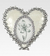 A lovely way to display a photo of one close to your heart, this charming frame of pearly enamel is edged with shimmering Swarovski crystals and silvery accents.Enamel and crystalWhite bronze finishHandmade, hand-enameled and hand-set4.5W X 4.5HMade in USA
