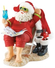 Off-duty Santa! After delivering all those gifts, the big guy deserves to sit back and relax. Sitting on a beach chair with a drink in hand, Santa unwinds and lets his toes run through the sand.