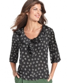 This petite top from Elementz features a grownup take on the polka dot print and a charming ruffled neckline. This petite top from Elementz features a grownup take on the polka dot print and a charming ruffled neckline.