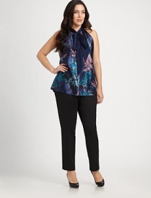 A floral-print front adds a romantic feel to this satin blouse. Its halter neckline will complement your neck and shoulders.Halter necklinePrinted frontSolid backPull-on styleAbout 31 from shoulder to hemPolyester/elastaneDry cleanImported