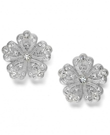 Button up your look in scintillating studs. Eliot Danori's polished style shines with the addition of dozens of round-cut crystals. Set in silver tone mixed metal. Approximate diameter: 3/4 inch. Button up your look in scintillating studs. Eliot Danori's polished style shines with the addition of dozens of round-cut crystals. Set in silver tone mixed metal. Approximate diameter: 3/4 inch.