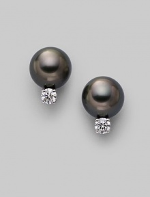 From the South Sea Collection. Classic black cultured pearl studs with sparkling diamond accents, set in 18k gold. 8mm black round cultured pearls Quality: A+ Diamonds, 0.20 tcw 18k white gold Post back Imported