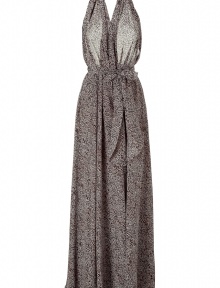 Sexy, simple dress in black patterned silk - Trendy floor-length maxi cut - Draped halter neckline with daring low back - Easy, fluid movement of flared skirt - Print in brown, black and cream, reminiscent of nature - Summer blockbuster dress pairs well with high wedged sandals