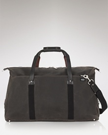 A handsome travel companion, this soft duffle makes toting your essentials a stylish affair. A handsome travel companion, this soft duffle makes toting your essentials a stylish affair.