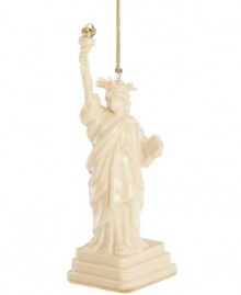 As statuesque as her inspiration, the Lady Liberty ornament welcomes guests to gather 'round. Her gold torch is radiant atop ivory porcelain with the esteemed craftsmanship of Lenox. As statuesque as her inspiration, the Lady Liberty ornament welcomes guests to gather 'round. Her gold torch is radiant atop ivory porcelain with the esteemed craftsmanship of Lenox.
