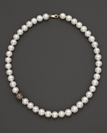 Freshwater pearls and diamonds gleam in a 14K. yellow gold setting. Freshwater pearls and diamonds gleam in a 14K. yellow gold setting.