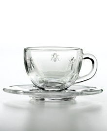 This whimsical glassware is abuzz with French history. Inspired by a travel set owned by Napoleon and the country's official coat of arms, each crystal-clear espresso cup and saucer is embossed with France's beloved bee. This whimsical glassware is abuzz with French history. Inspired by a travel set owned by Napoleon and the country's official coat of arms, each crystal-clear espresso cup and saucer is embossed with France's beloved bee.