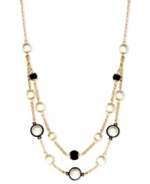 Be bold with some help from Anne Klein. This beaded necklace highlights plastic jet and pearl accents. Crafted in gold tone mixed metal. Approximate length: 16 inches + 2-inch extender.