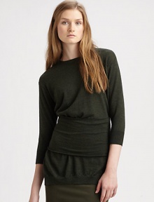 An understated classic, this fine-knit wool sweater has an exaggerated waistband, split hem and a bold back zipper. RoundneckDropped shouldersThree-quarter sleevesWide waistbandSplit hemExposed back zipperWoolDry cleanImportedModel shown is 5'10 (177cm) wearing US size Small.