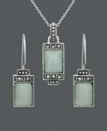 Express peace and tranquility in the form of pale, green hues. Cabochon jade stones (7 mm x 9 mm and 5 mm x 7 mm) make a serene statement when framed by the subtle glitter of marcasite. Genevieve & Grace set crafted in sterling silver. Approximate necklace length: 18 inches. Approximate pendant drop: 1 inch. Approximate earring drop: 1 inch.