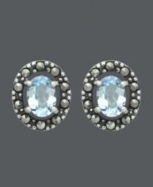 Button up your look in light blue hues. Genevieve & Grace stud earrings feature beautiful, oval-cut blue topaz gemstones (1-1/2 ct. t.w.) encircled by glittering marcasite. Crafted in sterling silver. Approximate diameter: 1/2 inch. Button up your look in light blue hues. Genevieve & Grace stud earrings feature beautiful, oval-cut blue topaz gemstones (1-1/2 ct. t.w.) encircled by glittering marcasite. Crafted in sterling silver. Approximate diameter: 1/2 inch.