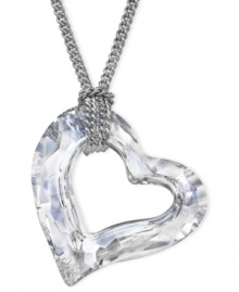 Fall in love with Swarovski's Loveheart pendant necklace. The chain, crafted from rhodium-plated mixed metal, holds a heart-shape pendant, sparkling in crystal diamond touch light. Approximate length: 15 inches. Approximate drop: 1 inch.